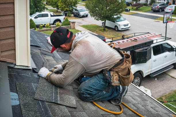 Professional Roofing technician working in Castella, CA
